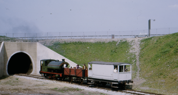 No. 6  on a passenger train, emerging from the tunnel.