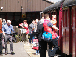 passengers boarding a train