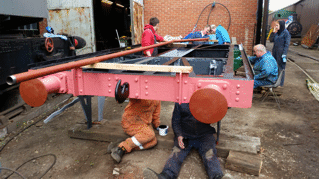 volunteers overhauling a goods wagon