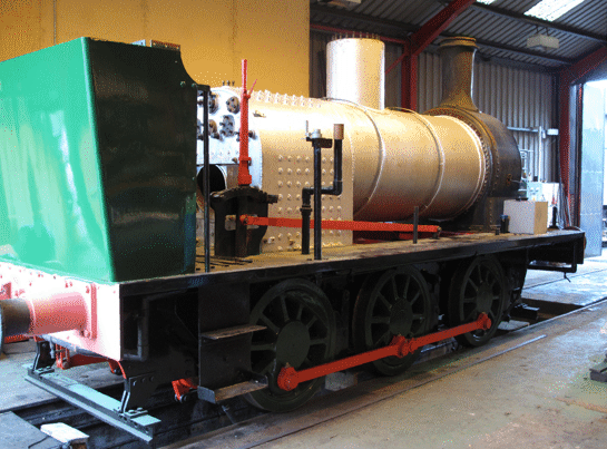 the loco in the workshop with the boiler in the frames