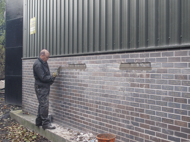 laying the corrected bricks