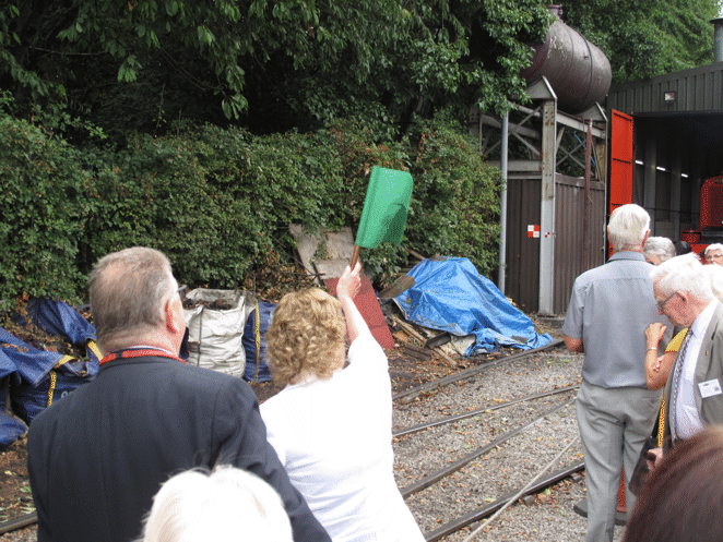 Judith Blake signalling to the locomotive drivers